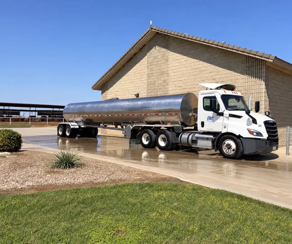 SBC stainless steel milk tanker parked at a dairy